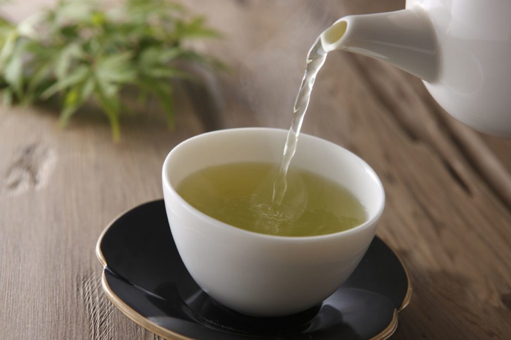 green tea pouring cup